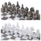 grey and white ancient egyptian gods chess figures