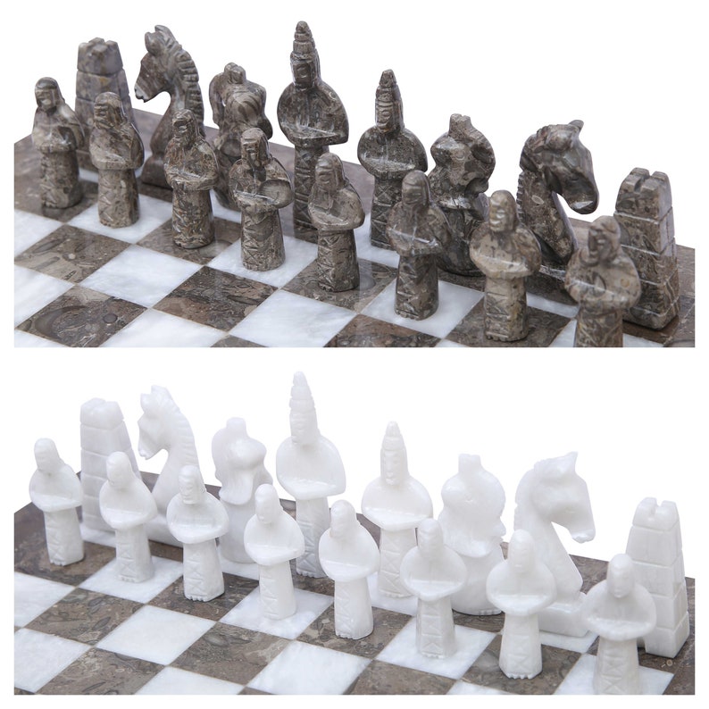 grey and white ancient egyptian gods chess figures